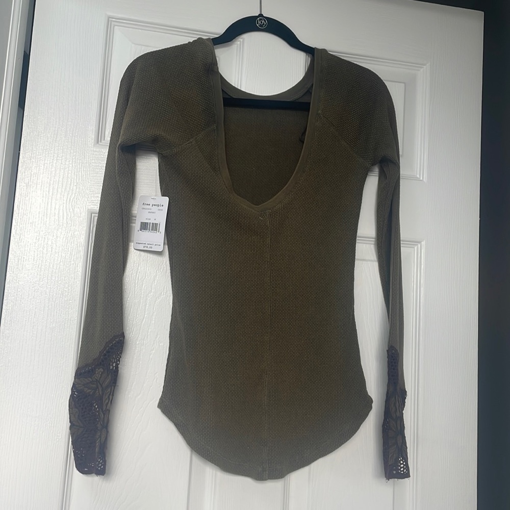 Womans long sleeve tee shirt with embroidered sleeve